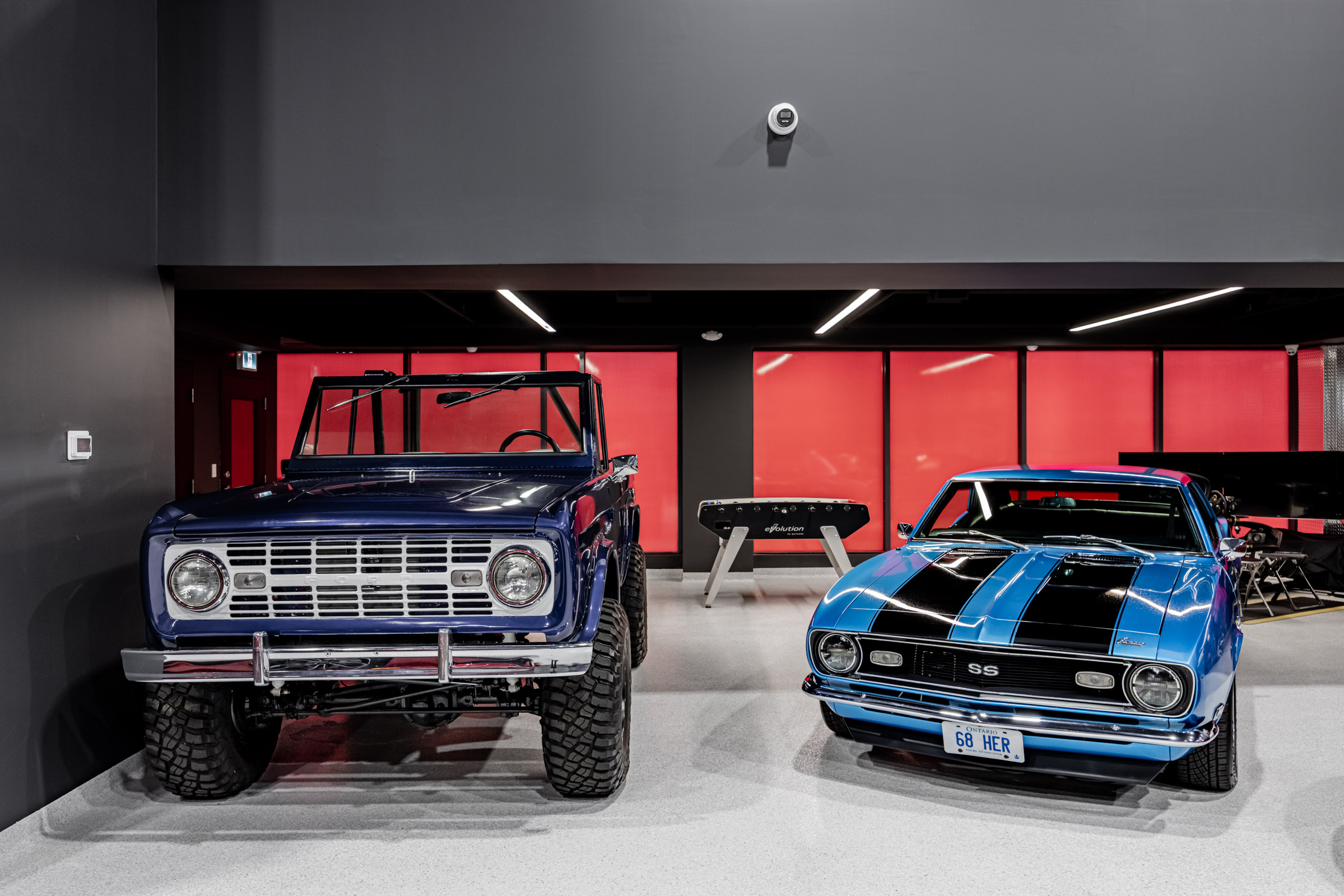 Classic Bronco and Camaro, close-up.