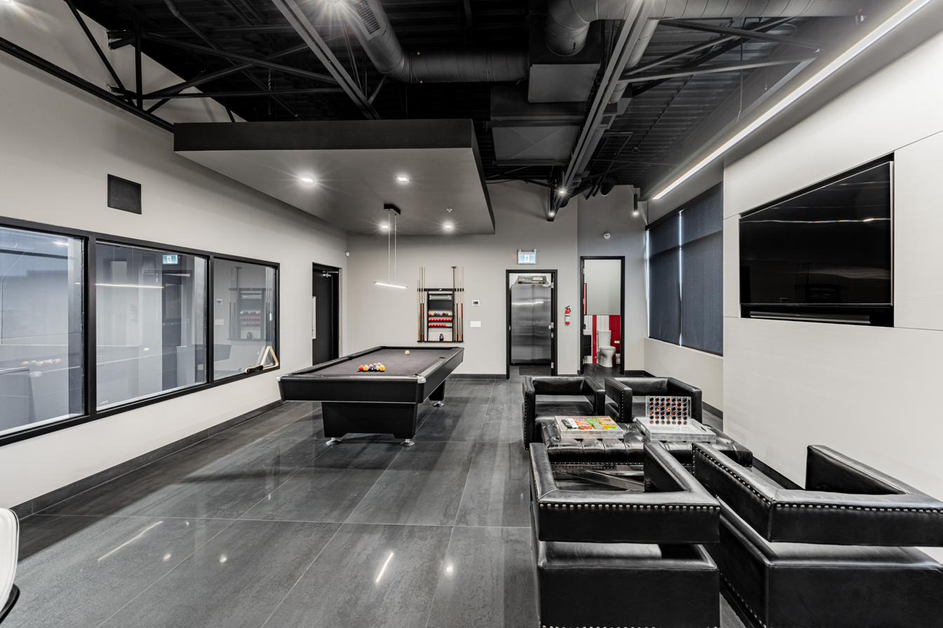 Second-floor lounge seating and pool table.